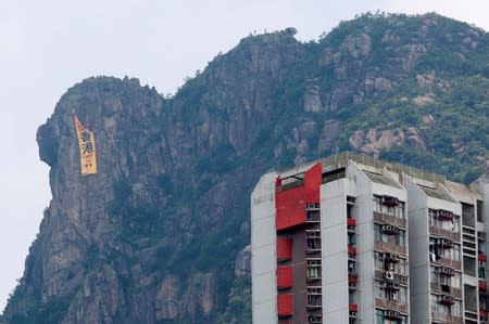 A large banner protesting against the extradition bill that reads, “Fight for HK” hung by pro-democracy protesters is seen in Hong Kong