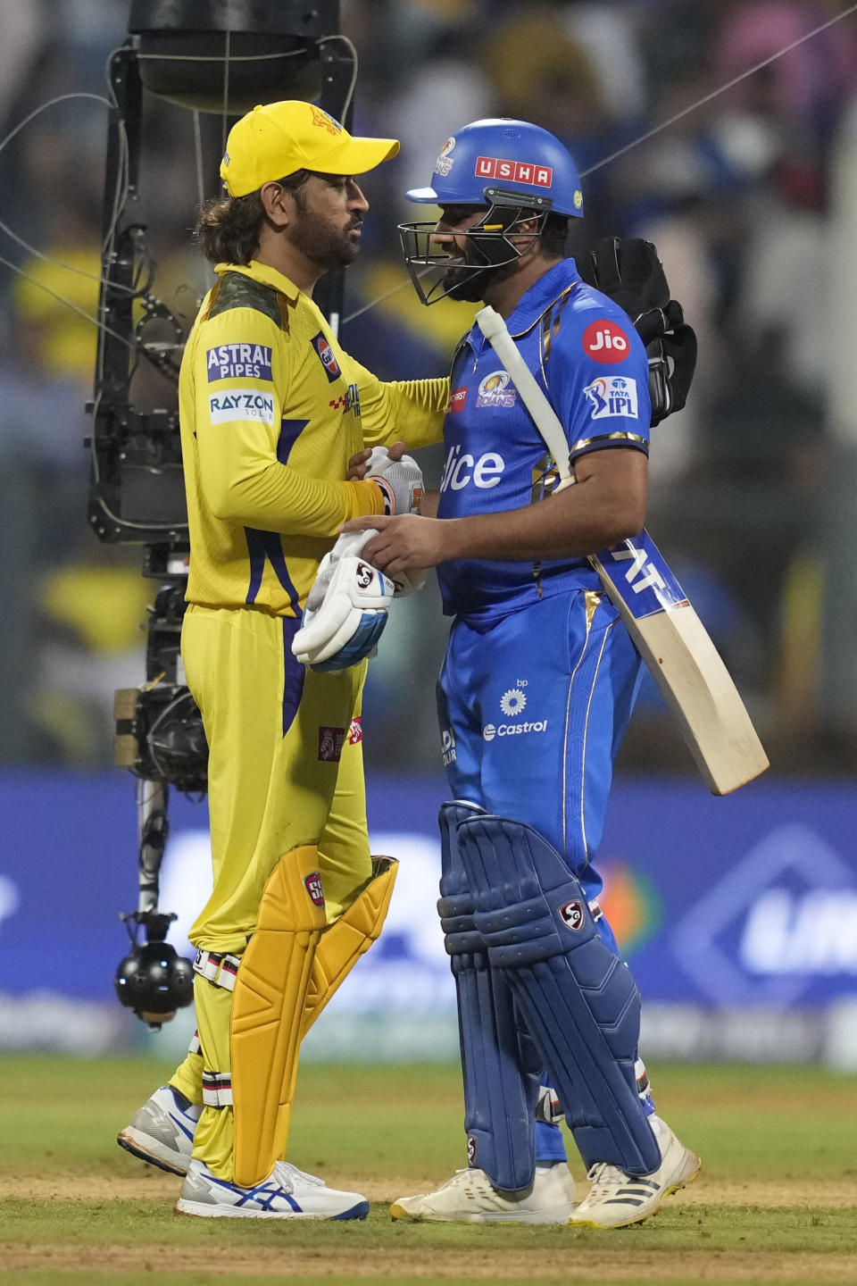 Mumbai Indians' Rohit Sharma , right, greets Chennai Super Kings' MS Dhoni at the end the Indian Premier League cricket match between Chennai Super Kings' and Mumbai Indians' in Mumbai, India, Sunday, April. 14, 2024.(AP Photo/ Rafiq Maqbool)