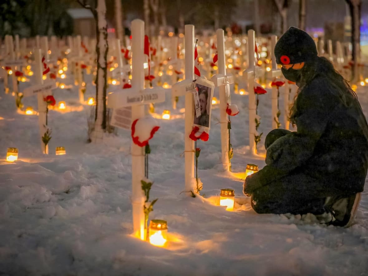 Candles are lit at the Field of Crosses in Calgary on Nov. 10, 2020.  (Leah Hennel/CBC - image credit)