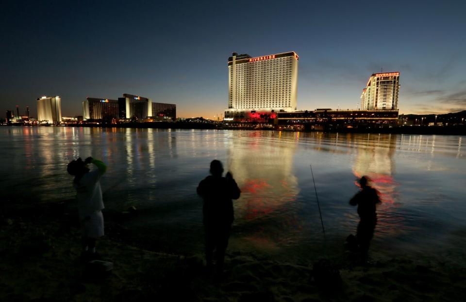 Fishermen cast their lines into the Colorado River near Laughlin, Nev.