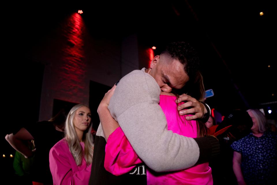 Desmond Ridder, former UC quarterback, embraces his mother, Sarah Ridder, as they react to him being selected by the Atlanta Falcons in the third round of the 2022 NFL Draft at his draft party in Louisville, Ky., on Friday, April 29, 2022. 