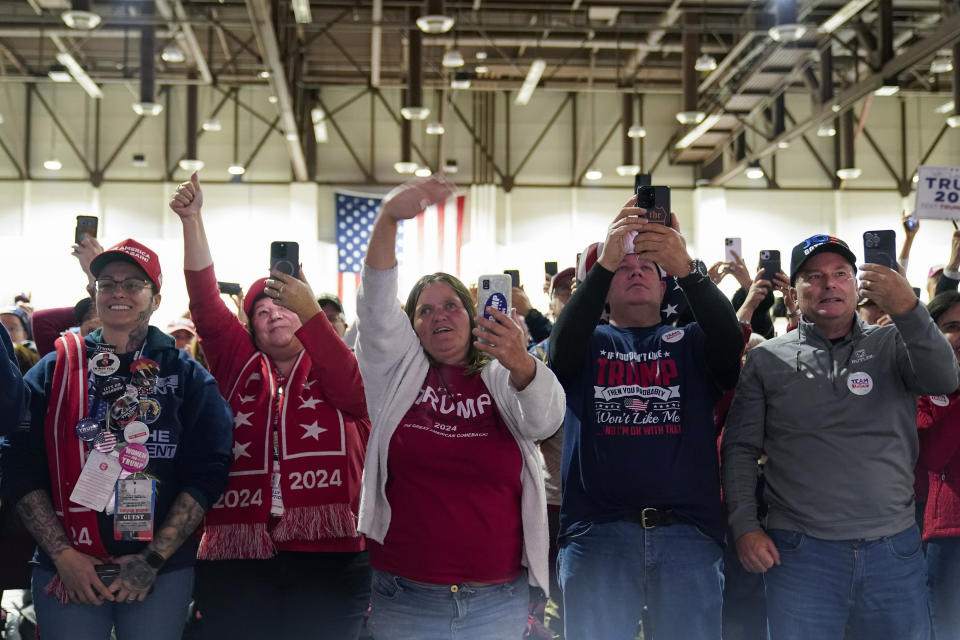 People cheer as former President Donald Trump is introduced during a rally Sunday, Dec. 17, 2023, in Reno, Nev. (AP Photo/Godofredo A. Vásquez)