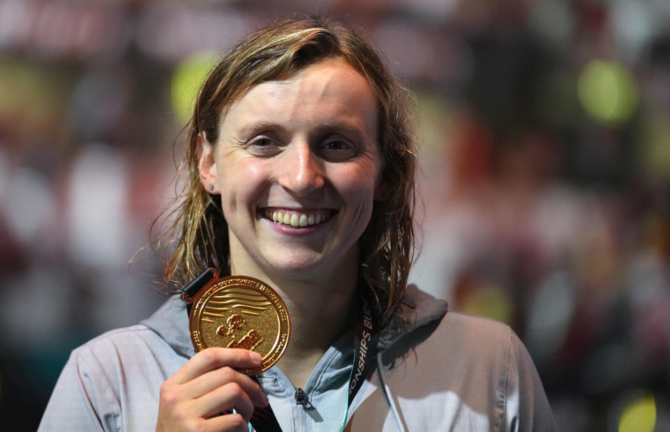 Gold medalist Katie Ledecky of the United States poses with her medal after the Women 800m Freestyle final at the 19th FINA World Championships in Budapest, Hungary, Friday, June 24, 2022. (AP Photo/Petr David Josek)