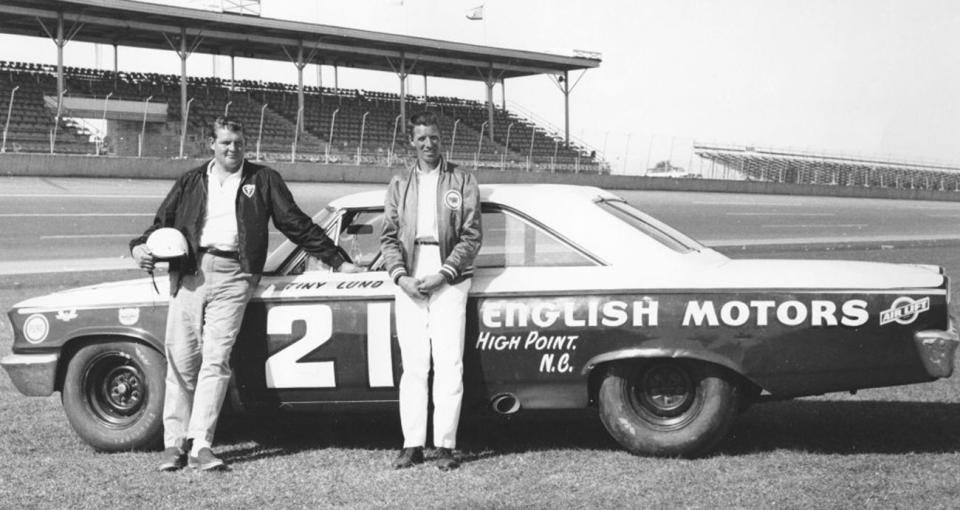 DAYTONA BEACH, FL — February 1963: Driver Dewayne “Tiny” Lund and car owner Glen Wood with the Wood Brothers 1963 Ford Galaxie that Lund drove to victory in the Daytona 500 NASCAR Cup race at Daytona International Speedway. Lund replaced the team‘s regular driver Marvin Panch after assisting other rescuers in pulling Panch from a burning sports car racer just days before. Panch was unable to compete in the 500, and his ride was offered to Lund, who went on to score the biggest win of his career. (Photo by ISC Images & Archives via Getty Images)