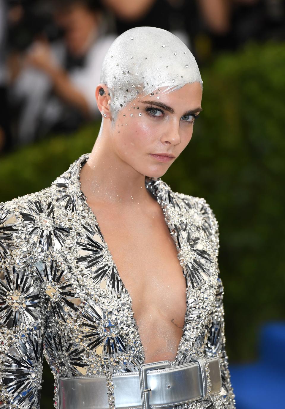 <p>Ah, memories. <a rel="nofollow noopener" href="https://www.glamour.com/story/cara-delevingne-met-gala-2017-bald-silver-head?mbid=synd_yahoobeauty" target="_blank" data-ylk="slk:This silver-painted look" class="link ">This silver-painted look</a> was the moment that told us Cara's wasn't going to be any old grow-out. She looks incredible, thanks to Roszak's silver paint pixie cut, complete with forehead wisps and a scattering of crystals. Part <em>Danny Phantom</em> and part alien chic, it's unlike anything a celebrity's done before.</p>
