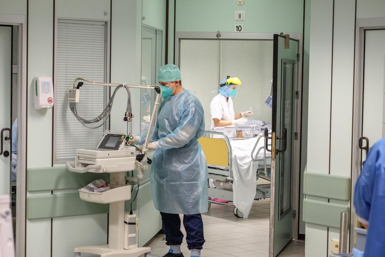 Medical staff work and tend to patients in the hospital CHR Citadelle in Liege, on 23 October (BELGA/AFP via Getty Images)