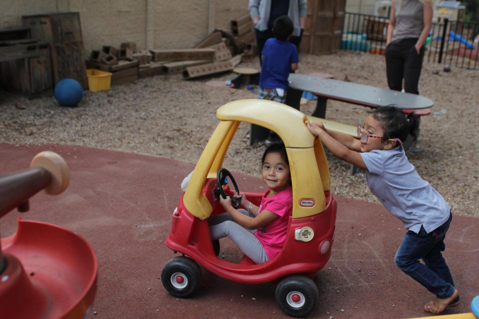 Children play outside at an Open Door Preschools location. All staff at Open Door are required to be vaccinated against COVID-19.