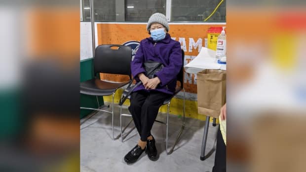 Betty Ing was the first person to enter the WFCU Centre on vaccination day, and was one of the first to receive the shot, according to WECHU.