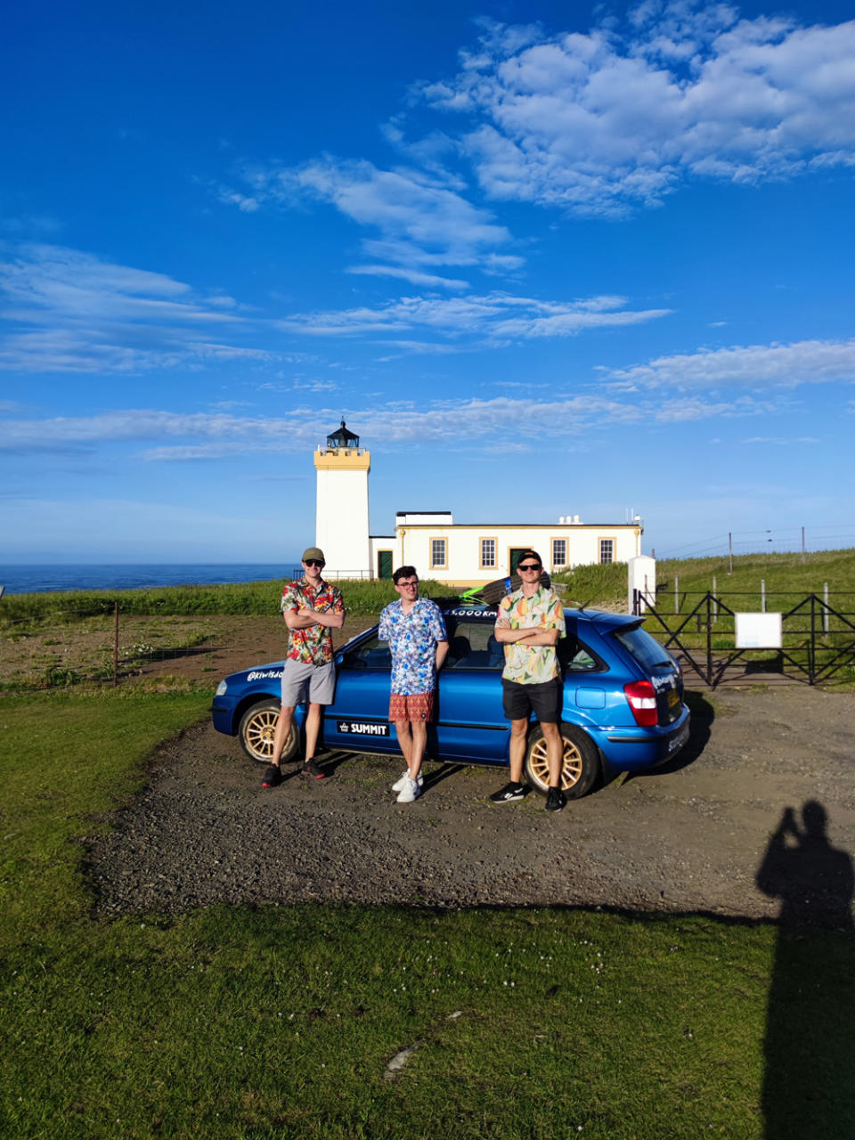 The friends setting off from the lighthouse 