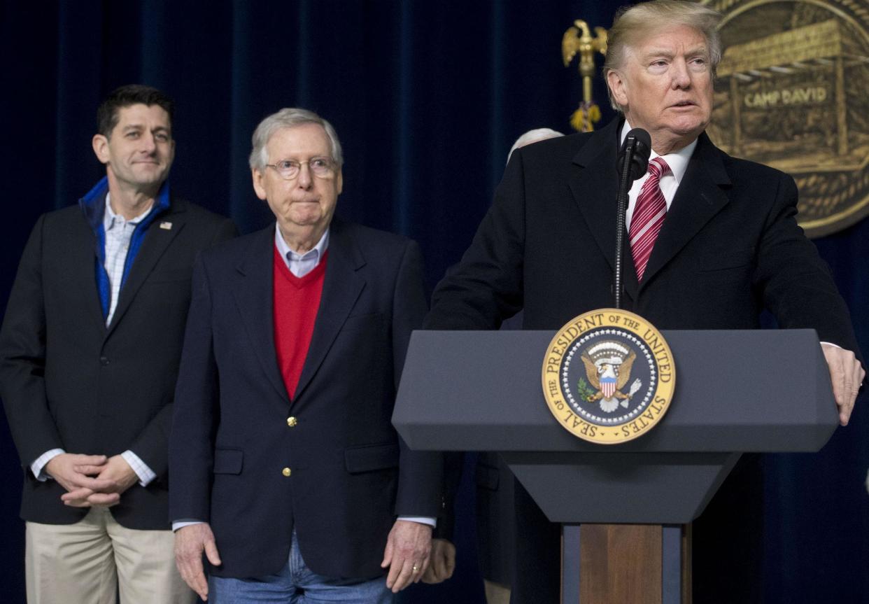 US President Donald Trump speaks alongside Speaker of the House Paul Ryan and Senate Majority Leader Mitch McConnell (SAUL LOEB/AFP/Getty Images)