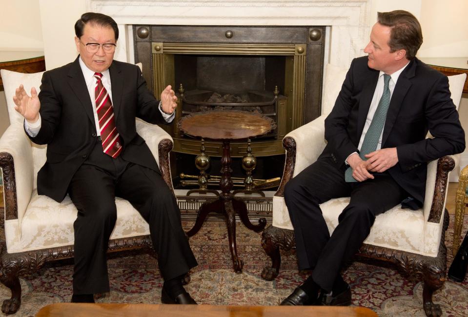 Chinese Communist Party official Li Changchun, left, speaks with British Prime Minister David Cameron, during their meeting at Downing Street in central London on Tuesday April 17, 2012. (AP Photo/Leon Neal. Pool)