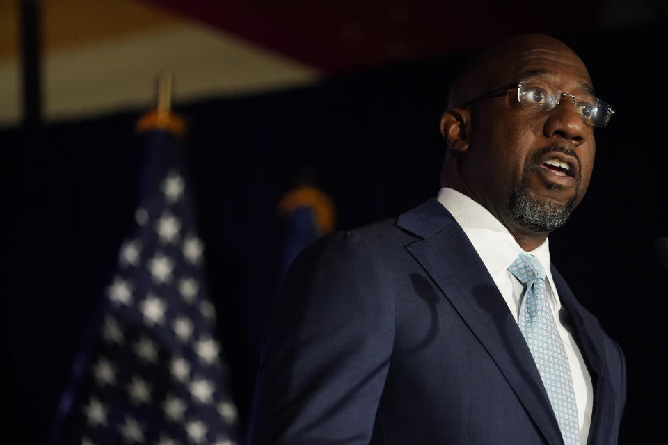 Raphael Warnock, a Democratic candidate for the U.S. Senate speaks during a rally, Tuesday, Nov. 3, 2020, in Atlanta. (AP Photo/Brynn Anderson, Pool)