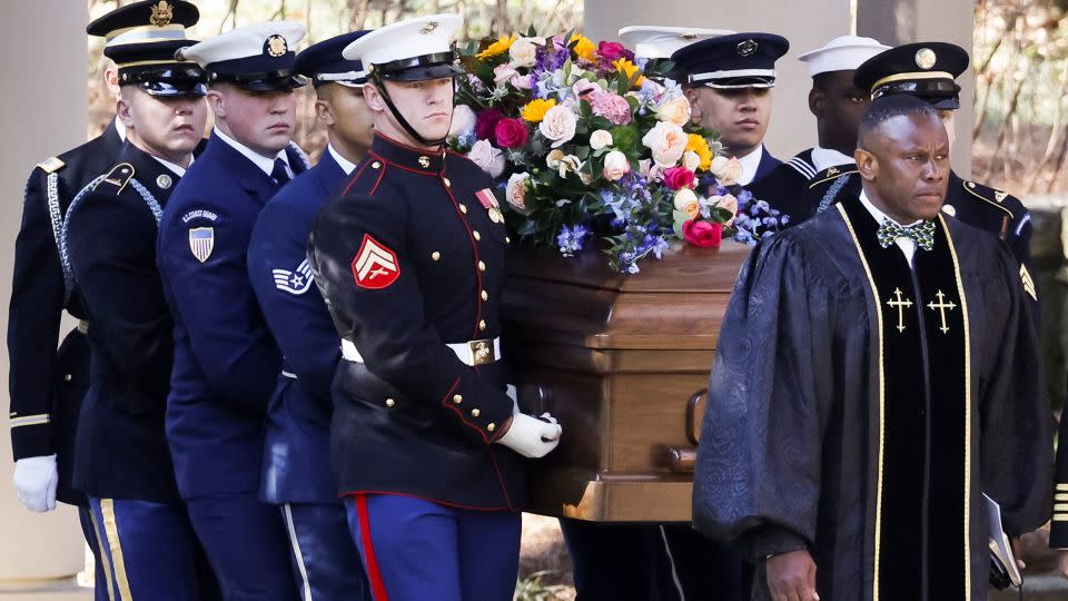 A military honor guard carries Rosalynn Carter's casket from the Jimmy Carter Presidential Library and Museum on Tuesday en route to the tribute service.  - Erik S. Lesser/Pool/Getty Images