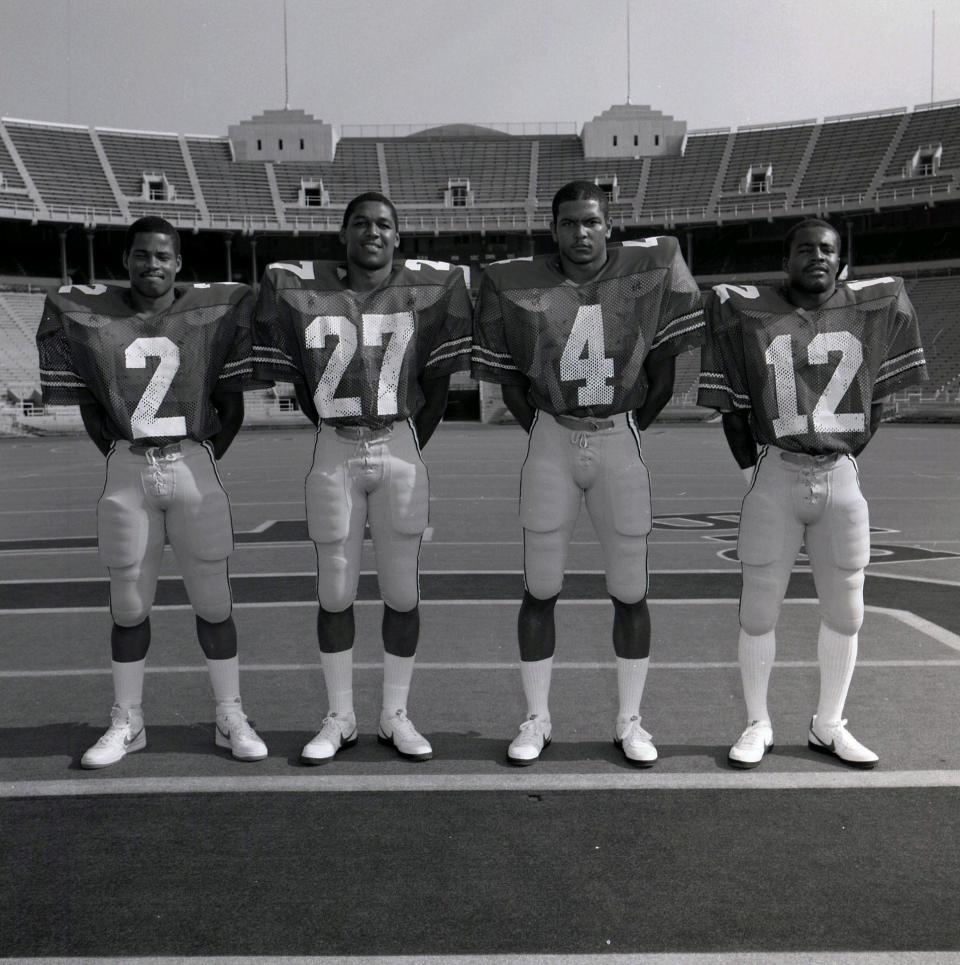 Kelvin Bell (4) poses with Ohio State teammates (from left to right) Shaun Gayle, Doug Hill and Garcia Lane.