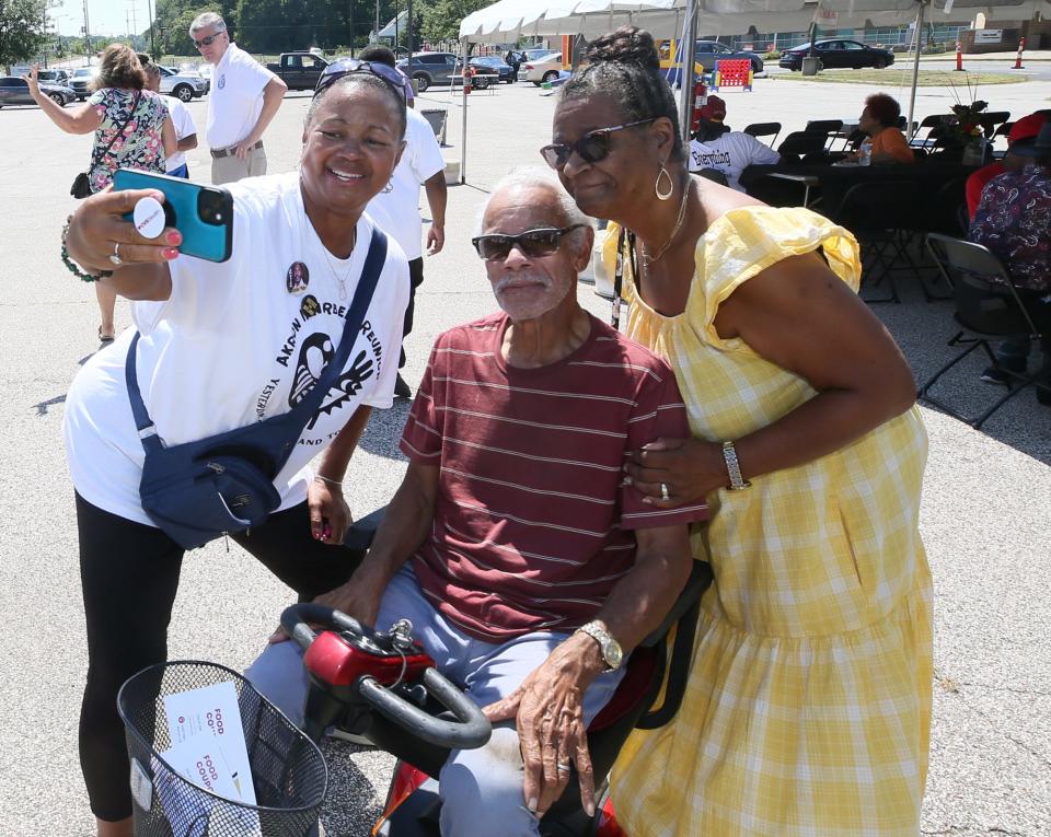 Judi Hill, Akron NAACP president, takes a selfie with Norris and Cheryl Hill at the Innerbelt Reunion at the Akron Urban League in Akron on Sunday.