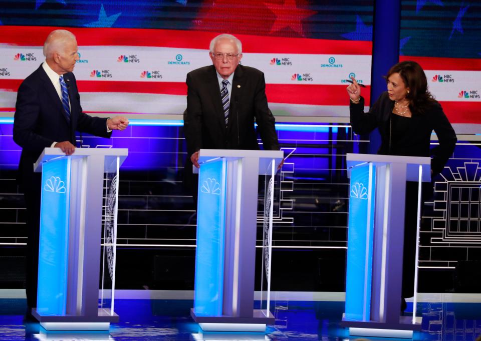 Former Vice President Joe Biden and Sens. Bernie Sanders and Kamala Harris debate on June 27, 2019.