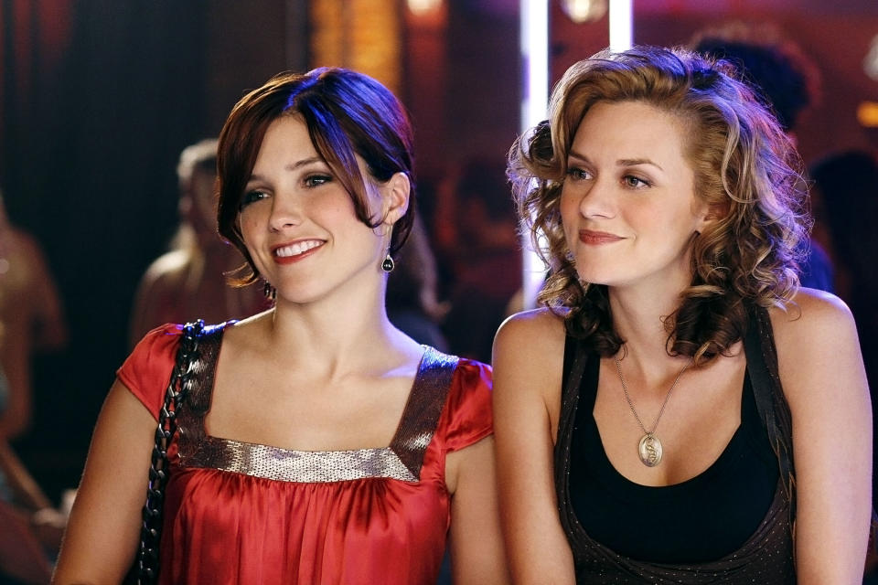 Sophia Bush and Hilarie Burton stand together