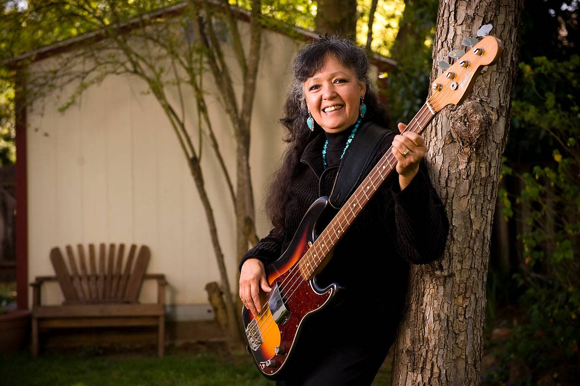 Jean Adamian holds her Fender Precision bass guitar at her Davis home in 2010. As Jean Millington, she and her sister June Millington started the band Fanny after playing high school events around Sacramento as The Svelts in the 1960s. Adamian suffered a stroke in recent years and hasn’t regained the ability to play the bass.