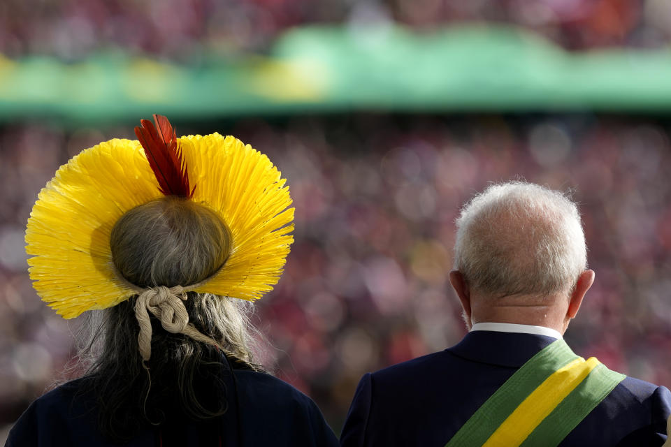 FILE - Brazil's President Luiz Inacio Lula da Silva, right, stands next to Indigenous leader Raoni Metuktire after his swearing-in ceremony at Planalto palace in Brasilia, Brazil, Jan. 1, 2023. For five decades, the Amazonian tribal Chief Raoni Metuktire and Belgium filmmaker Jean-Pierre Dutilleux enlisted presidents and royals to improve the lives of Brazil’s Indigenous peoples and protect their lands. (AP Photo/Eraldo Peres, File)