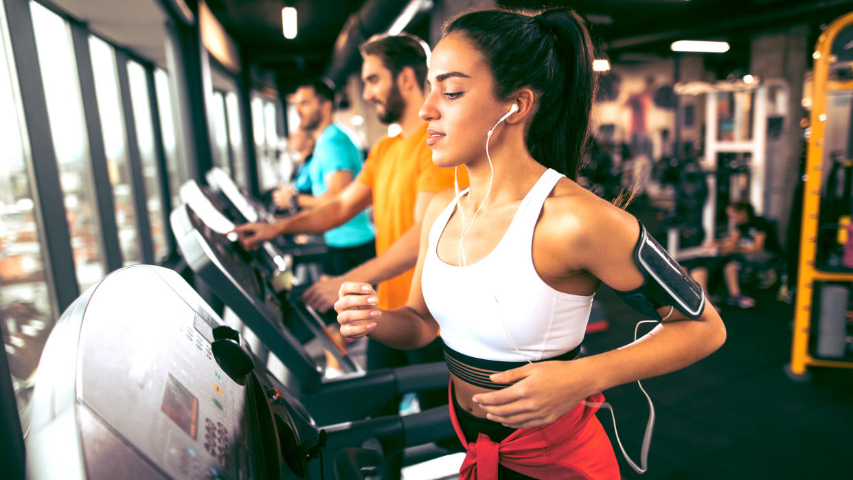  A photo of people in a gym running on treadmills. 