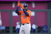 Houston Astros' Yordan Alvarez celebrates an RBI double against the Kansas City Royals in the fourth inning during a baseball game Tuesday, April 9, 2024, in Kansas City, Mo. (AP Photo/Ed Zurga)