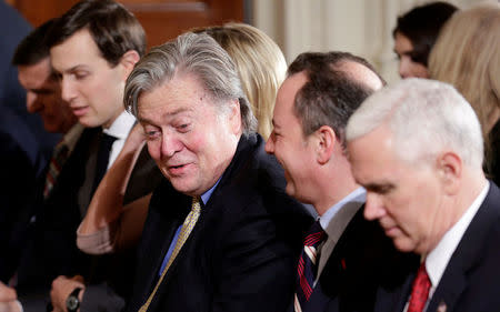 FILE PHOTO: White House Chief Strategist Stephen Bannon speaks with White House Chief of Staff Reince Priebus before Japanese Prime Minister Shinzo Abe and U.S. President Donald Trump arrive for their joint news conference at the White House in Washington, U.S., February 10, 2017. REUTERS/Joshua Roberts/File Photo