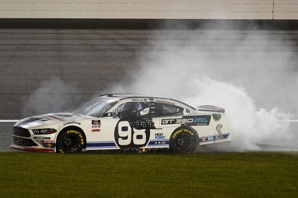 Chase Briscoe (98) celebrates after winning a NASCAR Xfinity Series auto race at Kansas Speedway in Kansas City, Kan., Saturday, Oct. 17, 2020. (AP Photo/Orlin Wagner)