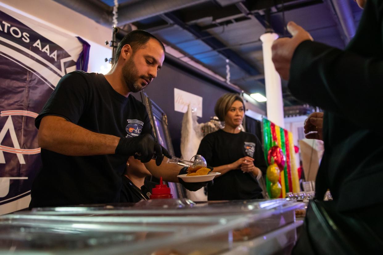 Francisco Apodaca works his stand at the Versalles Palace Event Center in Phoenix on Wednesday, Jan. 25, 2023.