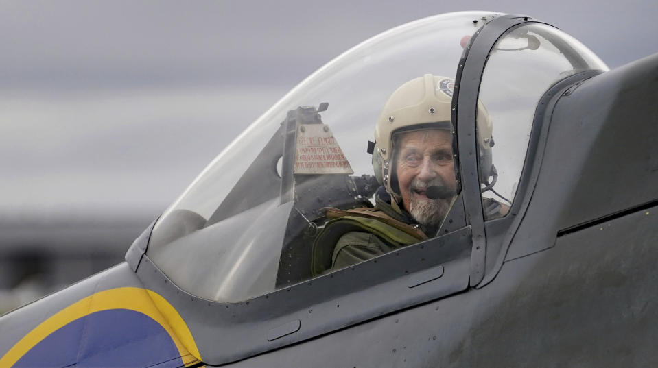 Jack Hemmings, 102, AFC, smiles after flying a Spitfire plane to mark 80th anniversary of the military charity Mission Aviation Fellowship (MAF) from the iconic Heritage Hanger at London Biggin Hill, England, Monday, Feb. 5, 2024. The former RAF Squadron Leader and pioneer of MAF, the world's largest humanitarian air service, wanted to become the oldest Briton to fly in a spitfire. Hemmings flew in Britain's best-loved Second World War aircraft to raise money for MAF, the charity he co-founded almost 80 years ago. (Gareth Fuller/PA via AP)
