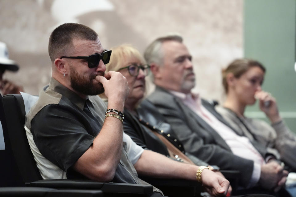 Philadelphia Eagles' Jason Kelce's family, from left, Kansas City Chiefs' Travis Kelce; mother, Donna Kelce; father, Ed Kelce; and wife, Kylie McDevitt Kelce, listens as Jason Kelce announces his retirement at an NFL football press conference in Philadelphia, Monday, March 4, 2024. (AP Photo/Matt Rourke)