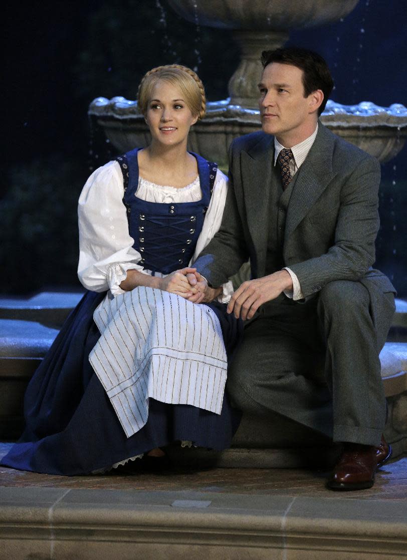 This image released by NBC shows Carrie Underwood, left, as Maria, and Stephen Moyer as Captain Von Trapp during preparations for "The Sound of Music Live!, in Bethpage, N.Y. The live production airs on Dec. 5 at 8 p.m. EST. (AP Photo/NBC, Paul Drinkwater)