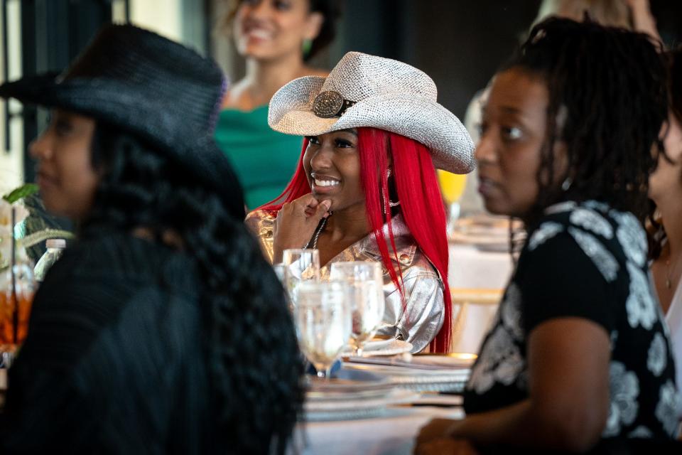 Reyna Roberts sits with other guests during the “I’m Just Me: A Charley Pride Celebration of Inclusion” event in Frisco, Texas., Tuesday, May 14, 2024.
