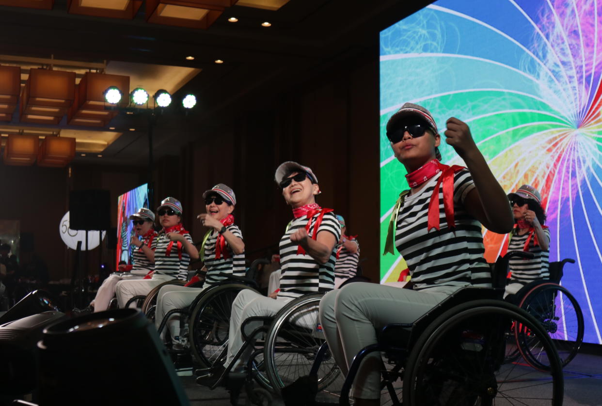 Members of the Handicaps Welfare Association performing at its 50th-anniversary dinner on 18 December, 2019. (PHOTO: Yahoo News Singapore)