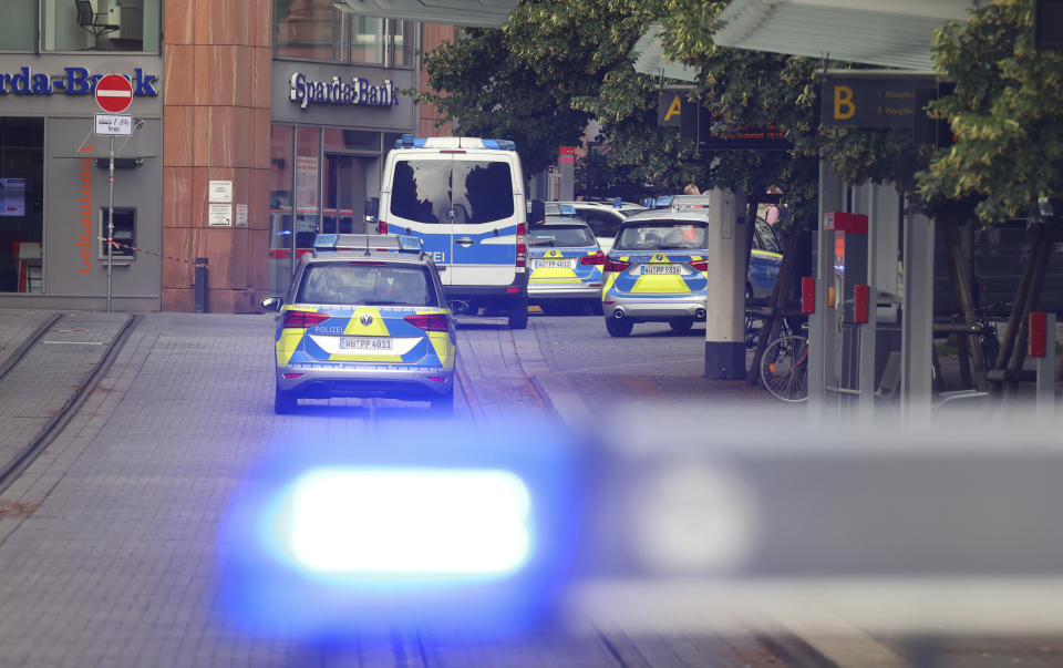 Police cars attend the scene of an incident in Wuerzburg, Germany, Friday June 25, 2021. German police say several people have been killed and others injured in a knife attack in the southern city of Wuerzburg on Friday. (Karl-Josef Hildenbrand/dpa via AP)