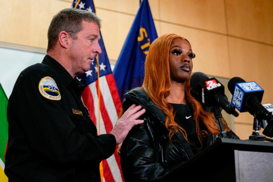 PHOTO: Portland Fire and Rescue spokesman Rick Graves, left, introduces Majiah Washington to speak during a news conference at the Portland Fire & Rescue headquarters, Jan. 18, 2024, in Portland, Ore.  (Jenny Kane/AP)