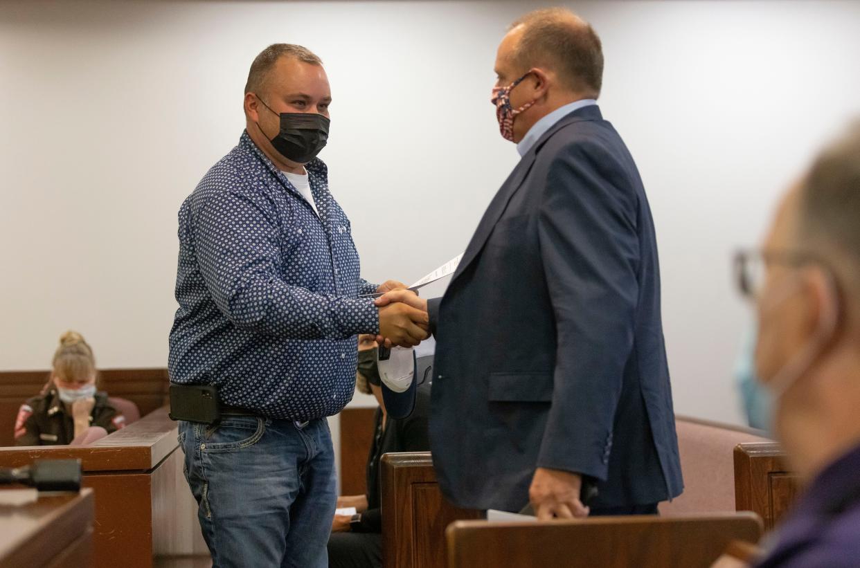 Thomas DeVore, right, arrives to represent Tyson Skinner and his wife, Marcie Skinner, in Sangamon County Circuit Court at the Sangamon County Complex in Springfield on Sept. 3, 2021. Through House Bill 3062, constitutional challenge lawsuits would have to be heard either in Sangamon or Cook County.
