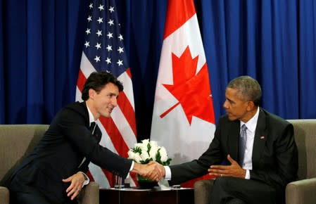 FILE PHOTO: Obama and Trudeau meet at the APEC Summit in Lima, Peru