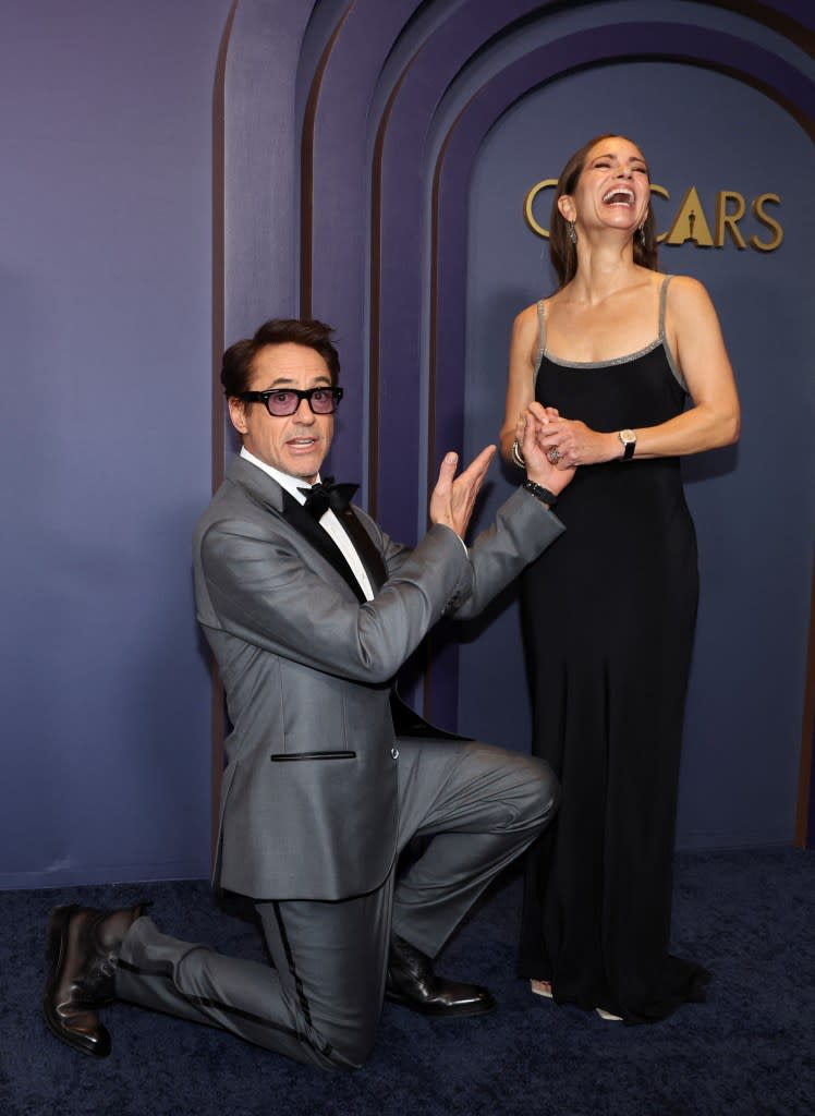 Robert Downey Jr. pretends to renew his vows to Susan Downey at the 2024 Governors Awards. REUTERS