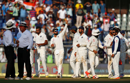 Cricket - India v England - Fourth Test cricket match - Wankhede Stadium, Mumbai, India - 11/12/16 - India's players celebrate the wicket of England's Ben Stokes. REUTERS/Danish Siddiqui