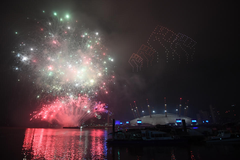 Fireworks and drones illuminate the night sky over London as they form a light display as London's normal New Year's Eve fireworks display was cancelled due to the coronavirus pandemic.