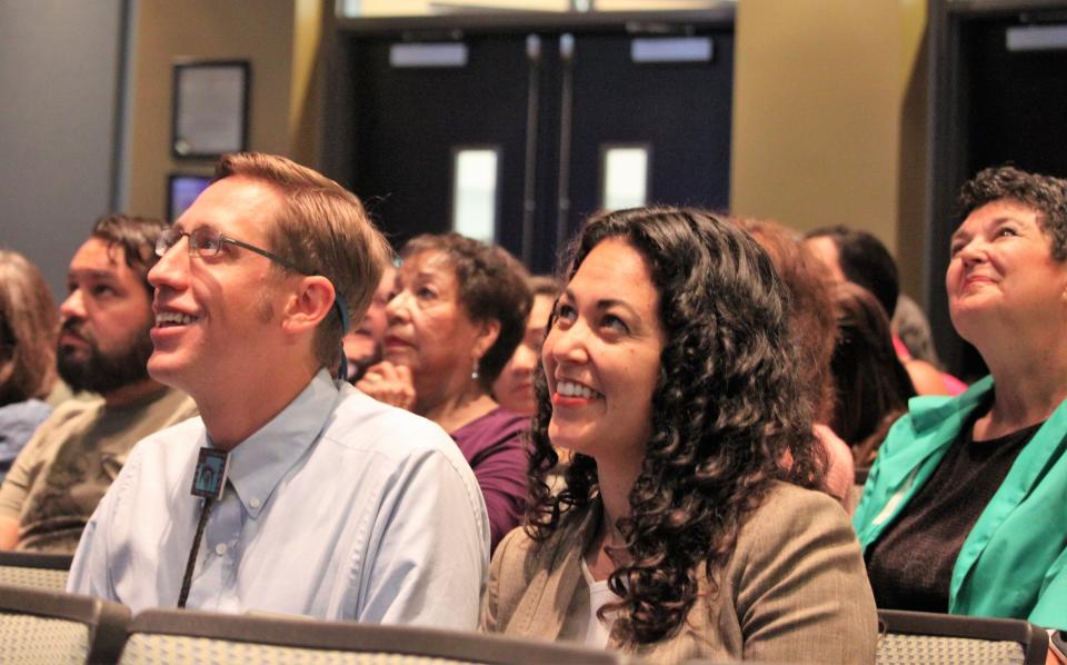 U.S. Rep. Xochitl Torres Small, D-NM, right, and her husband, New Mexico Rep. Nathan Small, D-Las Cruces, watch a presentation at the Las Cruces City Council meeting on Monday, Aug. 19, 2019.