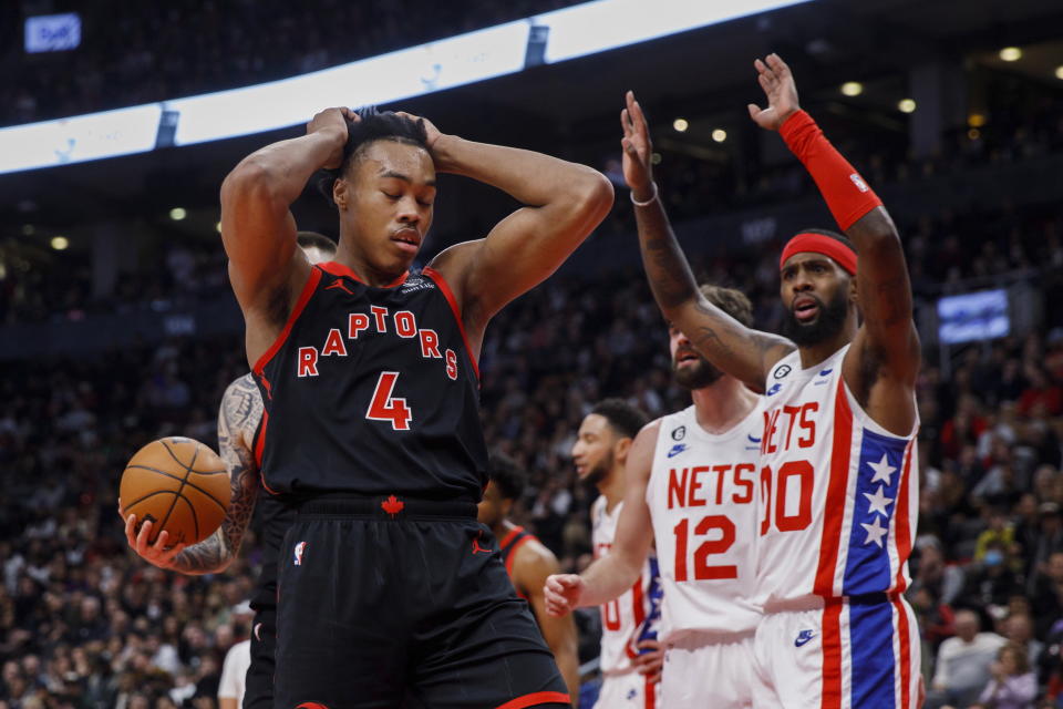 Toronto Raptors forward Scottie Barnes (4) reacts after being fouled by Brooklyn Nets forward Royce O'Neale (00) during the first half of an NBA basketball game in Toronto, Friday, Dec. 16, 2022. (Cole Burston/The Canadian Press via AP)