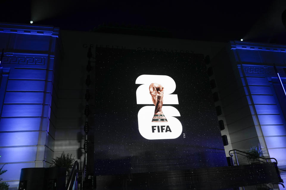 FILE - The logo for the 2026 World Cup is shown on a screen outside Griffith Observatory in Los Angeles on Wednesday, May 17, 2023. A unique 2030 World Cup is set to be played in Europe and Africa with the surprising addition of South America in a deal to allow the men’s soccer tournament to start with a 100th birthday party in Uruguay. (AP Photo/Jae C. Hong)
