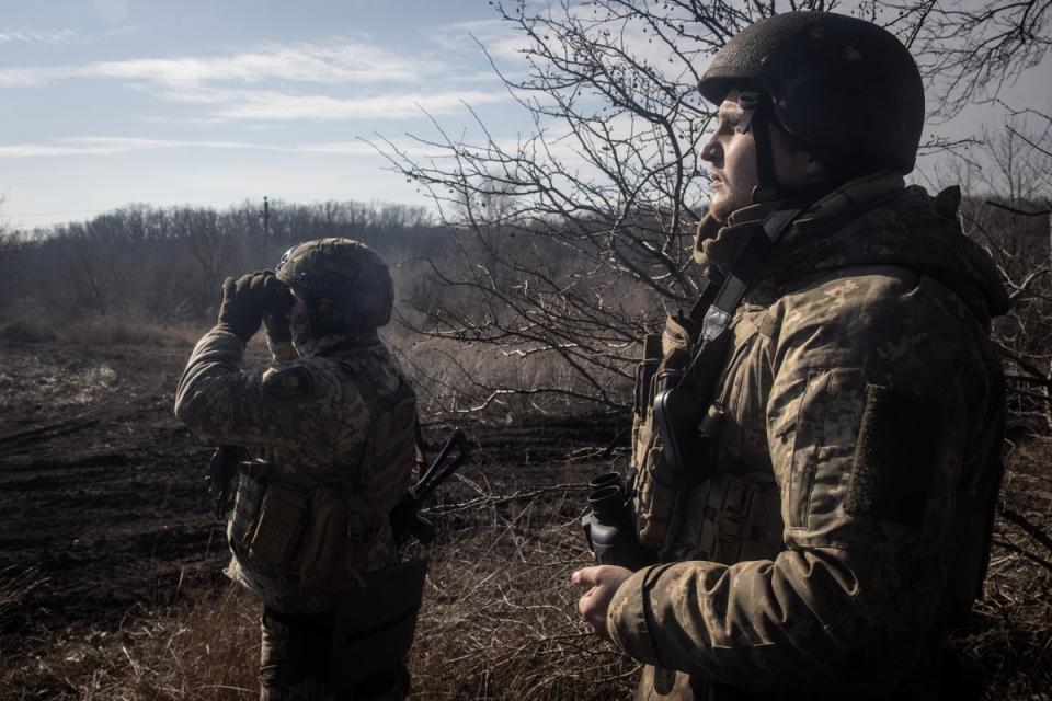 Members of Ukraine’s 72nd Brigade Anti-air unit use binoculars to search for Russian drones on 23 February 2024 near Marinka, Ukraine (Getty Images)