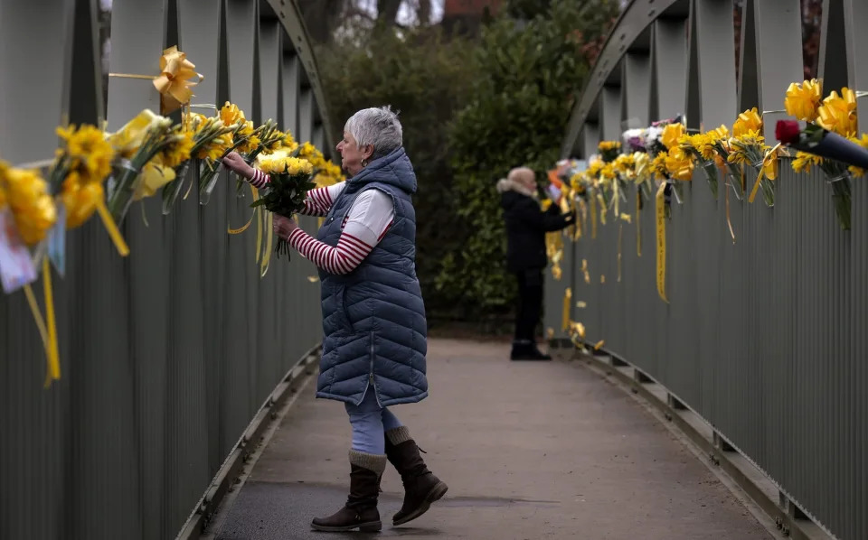 People attach flowers to a footbridge over the River Wyre in tribute to Nicola Bulley - Jeff J Mitchell/Getty Images