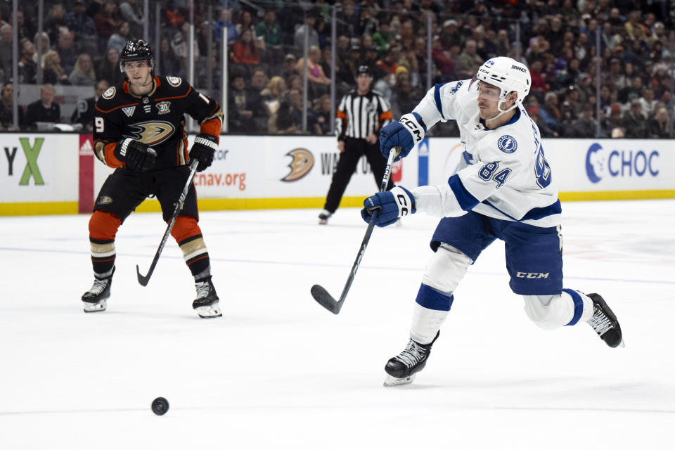 FILE - Tampa Bay Lightning left wing Tanner Jeannot (84) shoots during the second period of an NHL hockey game against the Anaheim Ducks, Sunday, March 24, 2024, in Anaheim, Calif. The Lightning sent two-time Stanley Cup-winning defenseman Mikhail Sergachev to Utah and depth forward Tanner Jeannot to Los Angeles in moves that cleared more than $11 million in salary cap space. (AP Photo/Kyusung Gong, File)