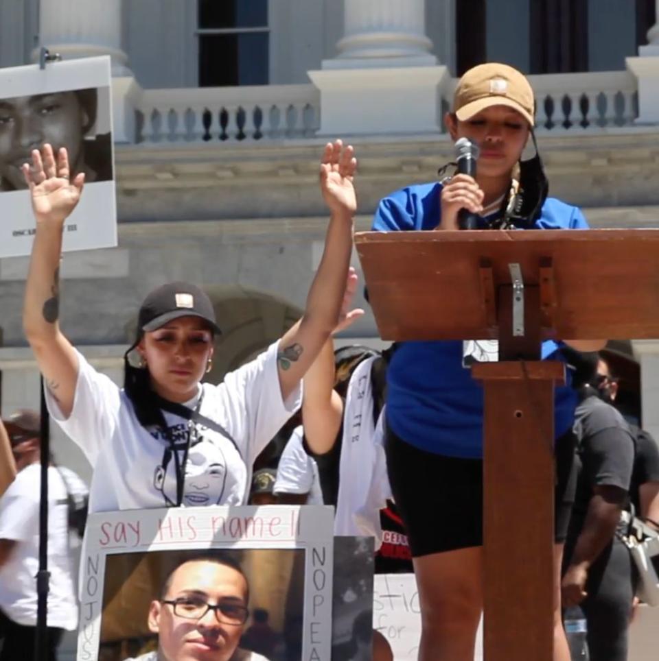 Sean Monterrosa's sisters Michelle (left) and Ashley (right) at a rally for victims of police violence in Sacramento, California, on July 1. (Photo: Monterrosa)