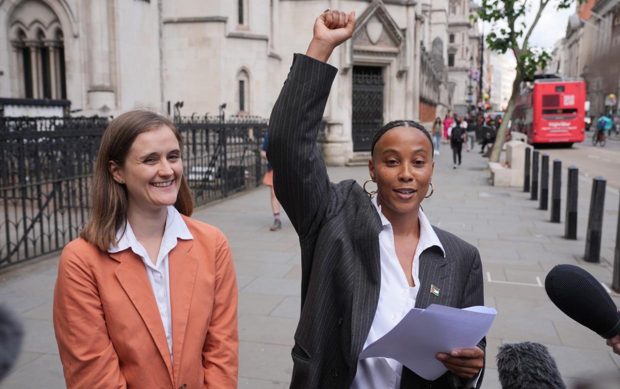 Ella Janneh celebrates with her fist in the air