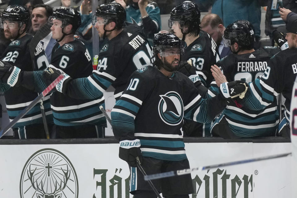 San Jose Sharks left wing Anthony Duclair (10) is congratulated by teammates after his goal against the Columbus Blue Jackets during the second period of an NHL hockey game in San Jose, Calif., Saturday, Feb. 17, 2024. (AP Photo/Jeff Chiu)
