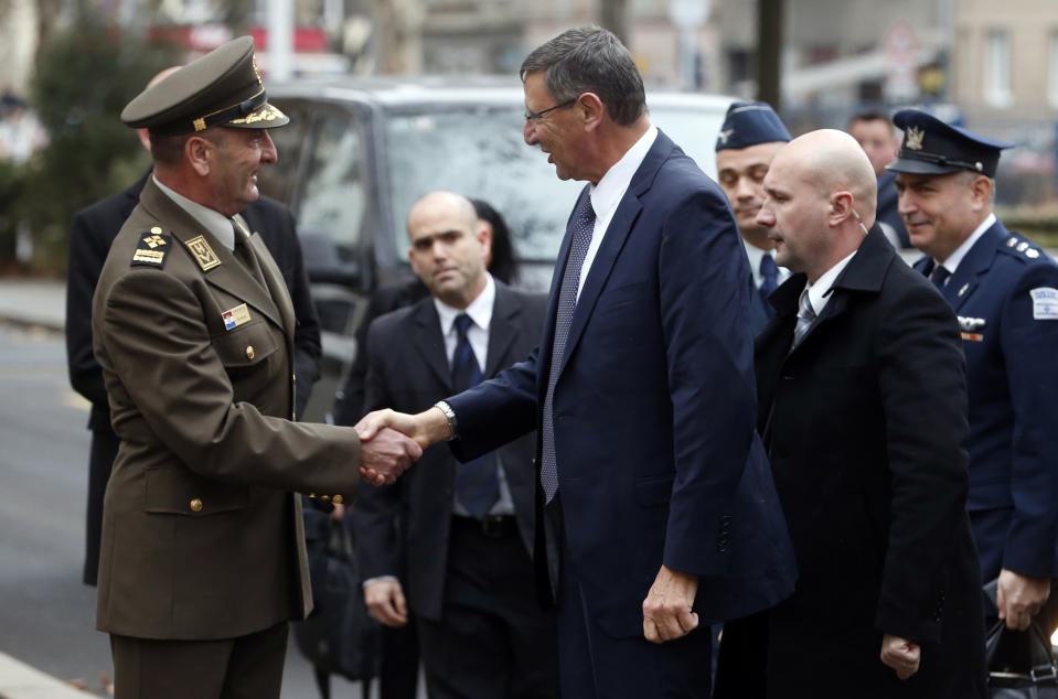Israel's delegation led by Ehud Adam, center, Director General of the Israeli Ministry of Defense, is welcomed by Mirko Sundov, Chief of Staff of Croatia's armed forces upon their arrival to the Croatian Ministry of Defense in Zagreb, Croatia, Thursday, Jan. 10, 2019. Croatia's defense minister says Israel has failed to overcome U.S. objections to a deal to sell 12 used fighter jets to Croatia and the agreement worth $500 million will likely be annulled. (AP Photo/Darko Bandic)